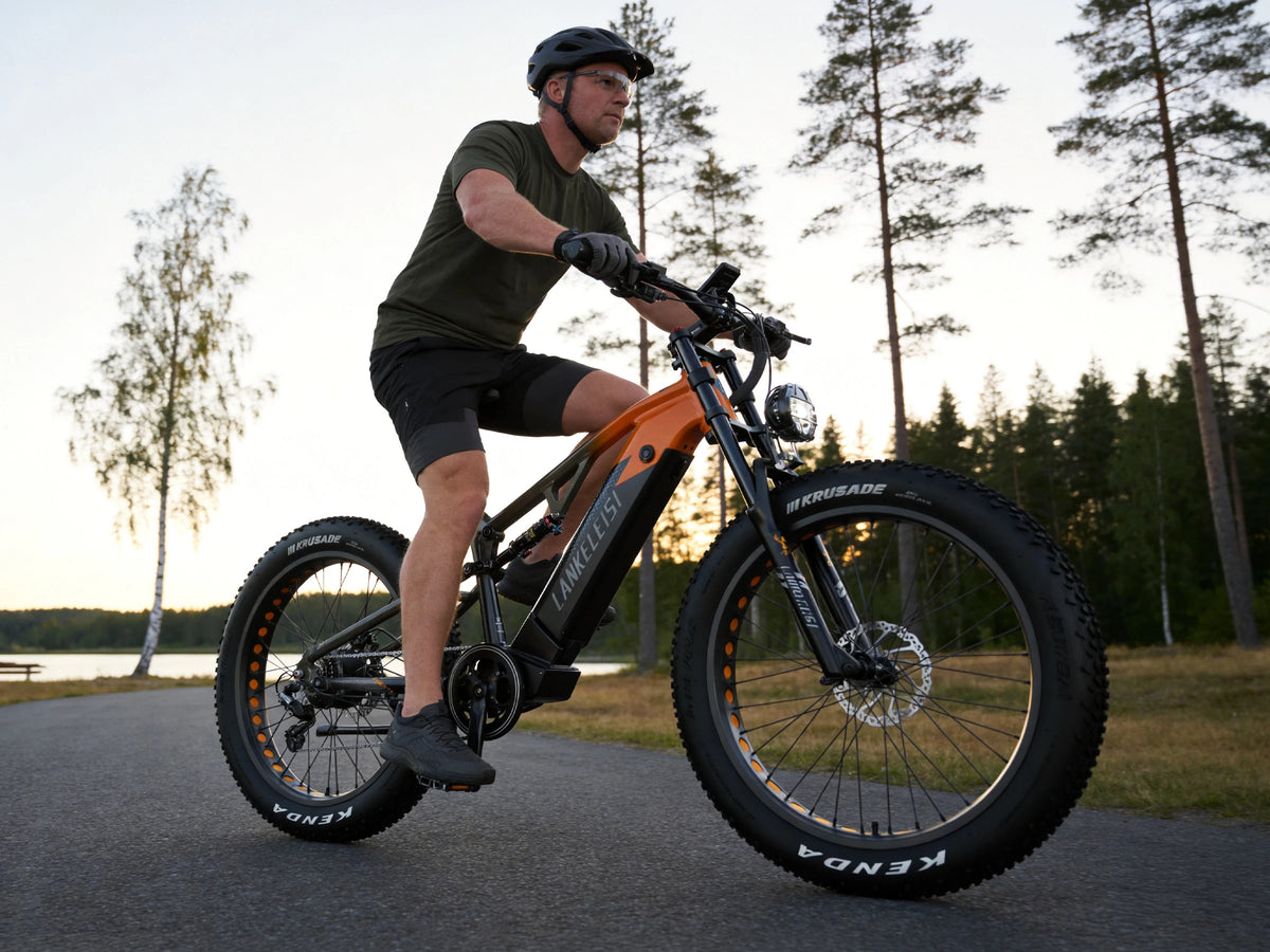 LANKELEISI RV800PLUS Black Orange fat tire e-bike riding near a forest road